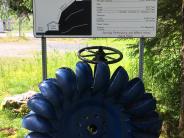 A piece of hydroelectric history - the 1950's Pelton wheel (runner) was removed from the Blind Slough generator in 1982. It now rests on it's concrete base next to the Blind Slough powerhouse. The Pelton Wheel has the signage in the picture, and is located at the Blind Slough hydro facility.