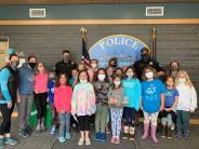 Girls on The Run stop in to deliver treats and thank you cards to Police Department. 