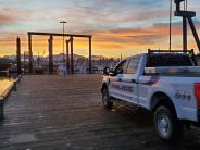 Police vehicle at boat harbor